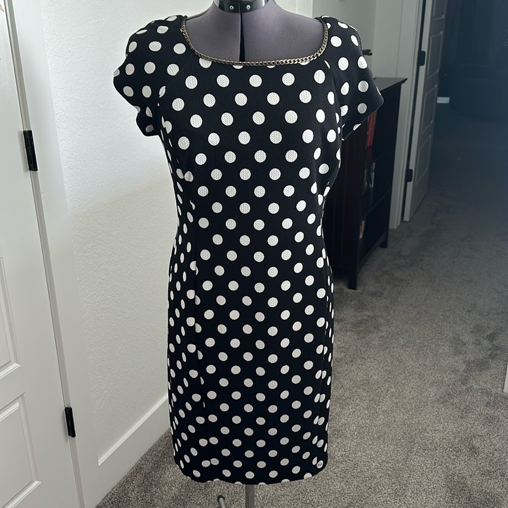 Women’s lined black dress with white polka-dots